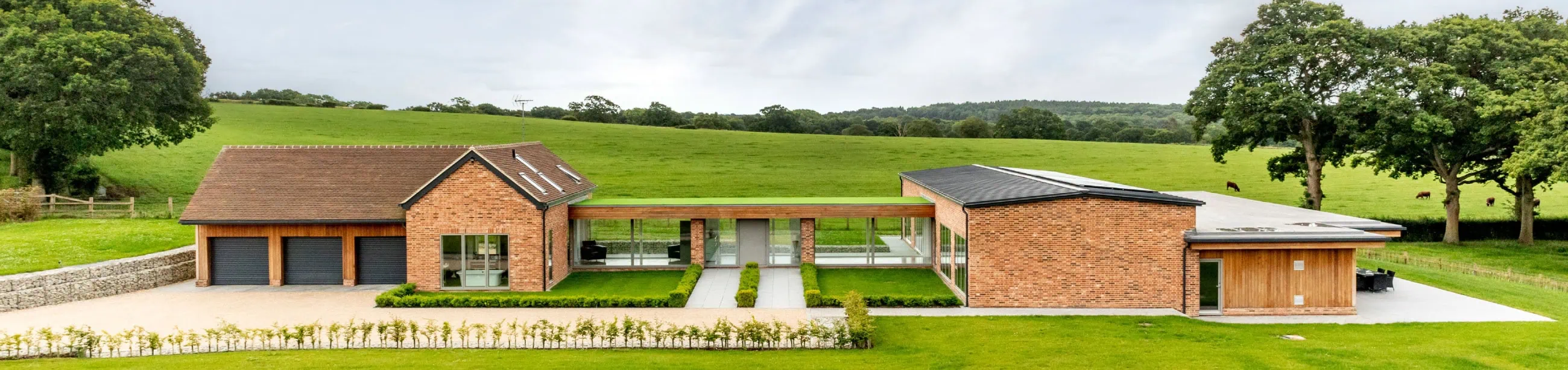 Timber frame house set in countryside